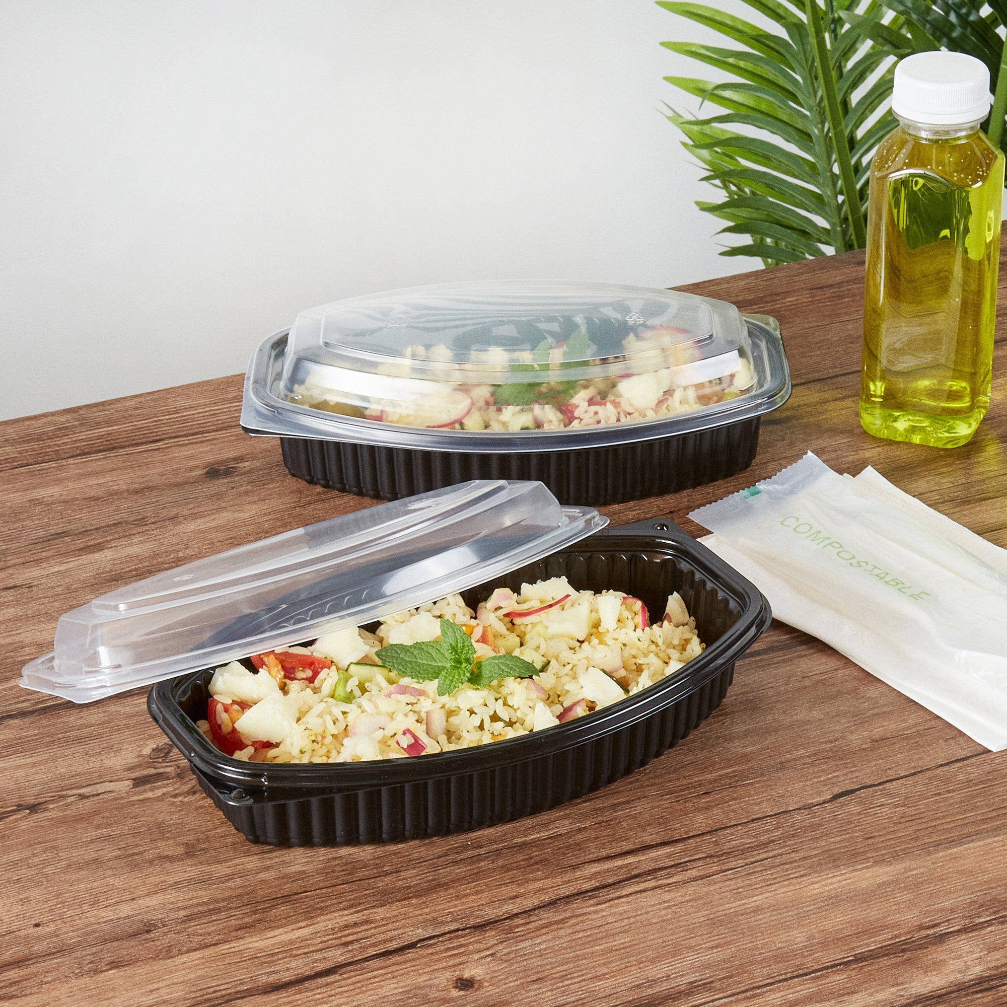 Chef 101 24 oz Oval Black Plastic Food Container - with Clear Lid, Microwavable - 9 1/4" x 5 3/4" x 2 1/2" - 100 count box