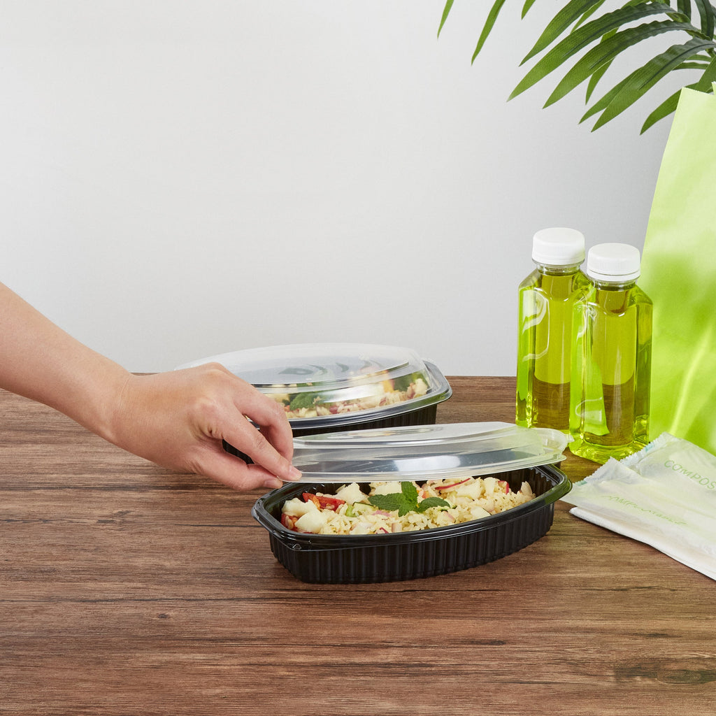 Chef 101 24 oz Oval Black Plastic Food Container - with Clear Lid, Microwavable - 9 1/4" x 5 3/4" x 2 1/2" - 100 count box