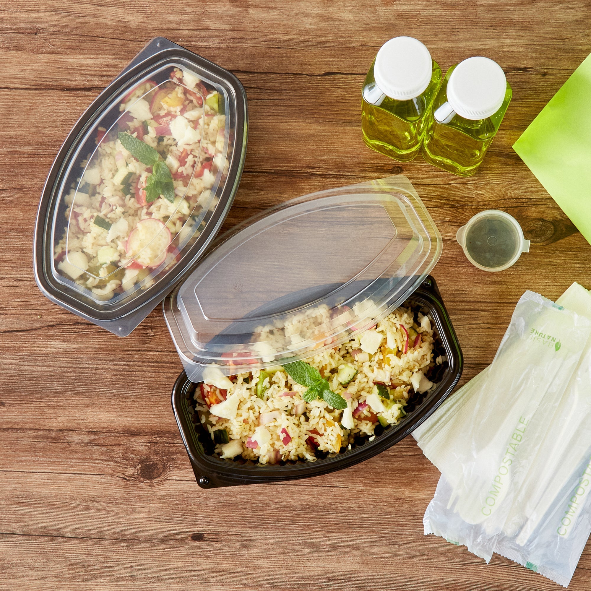 Chef 101 24 oz Oval Black Plastic Food Container - with Clear Lid, Microwavable - 9 1/4" x 5 3/4" x 2 1/2" - 100 count box